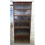 Globe Wernicke style glazed oak six division bookcase, the bottom piece being a two door cabinet.