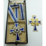 Two German Third Reich Nazi Mother's Cross of Honour medals / badges, one in box