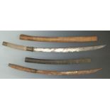 Two East Asian Dha swords both with curved blades and wooden scabbards, one with shagreen handle,