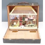 Perspex / acrylic dolls house or exhibition house with similar scale model furniture and people.