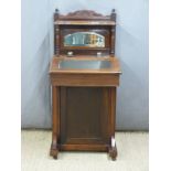 Victorian leather inset ash Davenport with mirror back, twin glass ink wells and cupboard below. W55