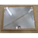 Ornate bevelled glass mirror. 103 x 134cm, and a table lamp