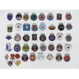 Approximately 40 enamel classic car keyring badges including Riley, Mini Cooper, Taylor's Gloucester