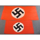 A large Nazi flag, 145 x 300cm, together with a smaller example 96 x 200cm