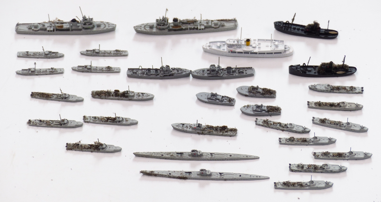 Thirty-one Neptun and similar diecast model waterline ships including Elco, largest 6cm long