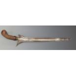 Sumatran Kris dagger with 35cm Damascus blade, carved handle and gilt mendak, overall length 46cm.