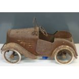 A vintage child's pedal car with opening doors, fold down windscreen and canvas seat, length