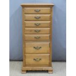 A modern oak cabinet with seven drawers manufactured by Imperial cabinet Co, Los Angeles, H123,