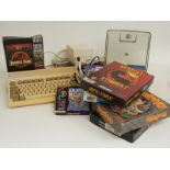 Commodore A600 Amiga games console together with joystick and various games including Mortal Kombat,