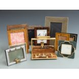 Ostrich skin cased manicure set and a quantity of inlaid and designer picture frames