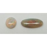 Two oval opal cabochons of approximately 1ct & 0.5ct and a round opal cabochon of approximately  0.