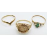 A 9ct gold ring set with a diamond, a 9ct gold ring set with an emerald and diamonds and another 9ct