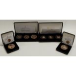 Four Heirloom Coins and coin sets "The Life and Times of Her Majesty the Queen" etc.,each gold