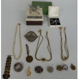 An enamelled crown, a white metal brooch, two Christian Dior necklaces, brooches etc
