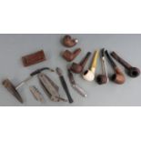 A collection of pipes etc including Falcon folding knife