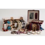 A collection of costume jewellery including silver bangle, silver pendant, a section of filigree,