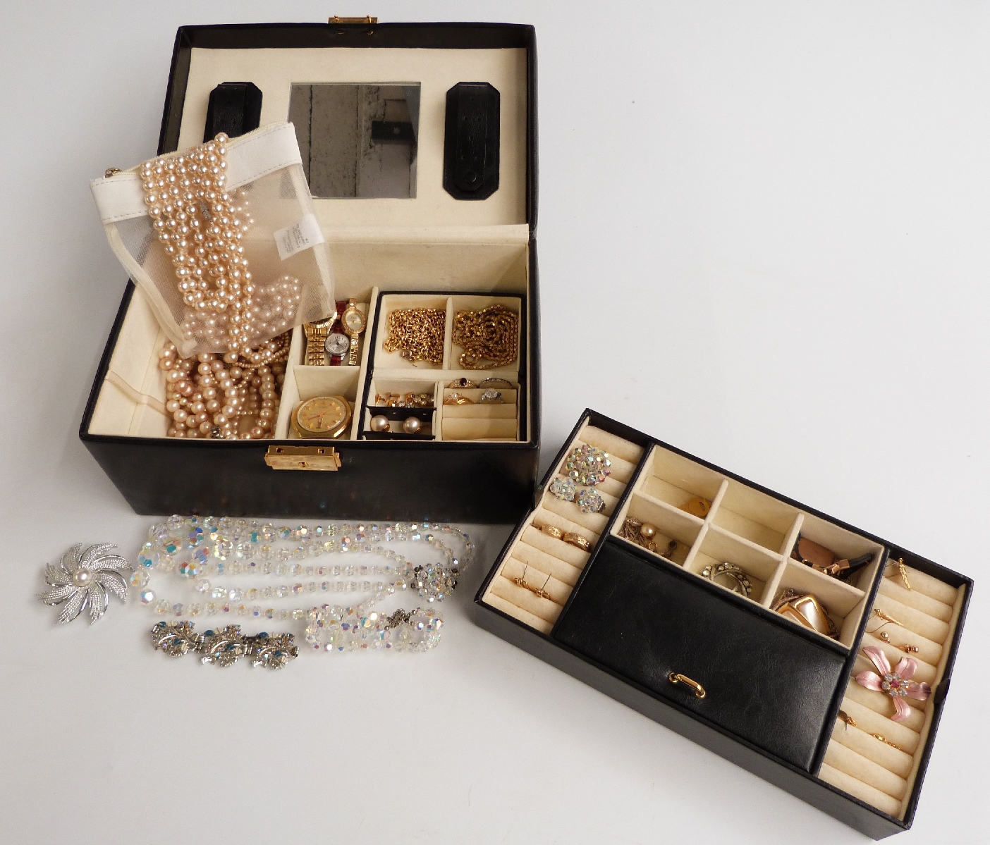 A collection of costume jewellery including a 9ct gold watch, Sarah Coventry brooch, watches,