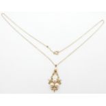 A 9ct gold pendant set with pearls, on a 9ct gold chain, 2.9g, 25cm drop