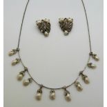 A necklace set with marcasite and blister pearls together with matching clips