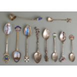 Ten various white metal souvenir spoons, mostly marked 800 but including a Swedish example and