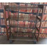 Industrial/haberdashery/shopfitting steel and weldmesh display/shelf unit raised on wheels with an