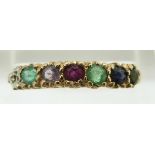 A 9ct gold ring set with a diamond, emerald, amethyst, ruby, emerald sapphire and tourmaline reading
