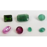 An emerald cut emerald, two oval cut emeralds and a round cut emerald, an emerald cut tourmaline,