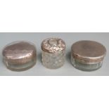 Three hallmarked silver lidded dressing table pots, diameter of largest 9cm