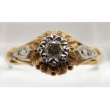 An 18ct gold ring set with diamond in a textured floral setting, 2.6g, size N