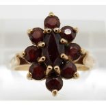 A 9ct gold ring set with garnets, 3.3g, size M