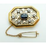 A yellow metal brooch set with an oval cut sapphire and diamonds in lattice setting, 6.4g, 2.8 x 1.