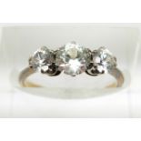 An 18ct gold ring set with three white sapphires, 2g, size J