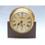 Brass bulkhead/marine clock with Dent, 28 Cockspur Street, London, 62677 to Roman dial, the spring