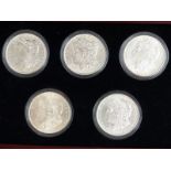 Five Decade Set of Uncirculated Morgan Silver USA dollars, in deluxe case