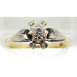 An 18ct gold ring set with a diamond in a platinum setting, 2.7g, size K