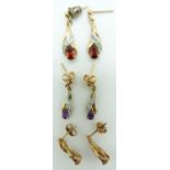 A pair of 9ct gold earrings set with a ruby and diamonds to each, an amethyst pair and a garnet pair