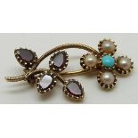 Victorian brooch set with foiled garnets, seed pearls and a turquoise cabochon, 2.6cm long