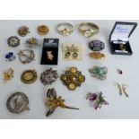 A collection of brooches including silver, Miracle, enamel, Timex watch, automatic Smiths watch, a