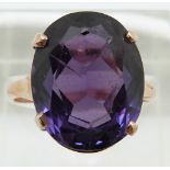 A 14ct gold ring set with a large synthetic colour change sapphire, 4.9g, size P