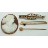 Two 9ct gold brooches, a Victorian stick pin and a cameo, 4g