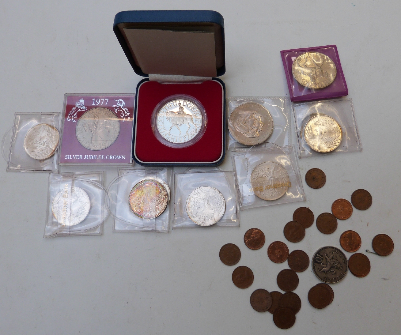 A small collection of commemorative coins etc including seven silver 1972 Munich Olympic examples,
