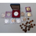 A small collection of commemorative coins etc including seven silver 1972 Munich Olympic examples,