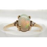 A 9ct gold ring set with an opal and diamonds, 1.3g, size J