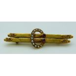 Edwardian hallmarked 15ct gold brooch set with rubies and seed pearls and two rubies in a buckle