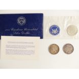Three USA silver dollars comprising 1922 and 1924 Liberty examples and a 1971 uncirculated