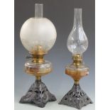 Two oil lamps with cast bases