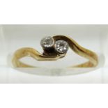 An 18ct gold ring set with two old cut diamonds, 2.1g, size K