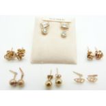 Three pairs of 9ct gold earrings (1.8g), two pairs of 9ct gold earrings set with cubic zirconia