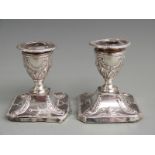 Pair of Victorian hallmarked silver squat candlesticks with neoclassical decoration, Sheffield