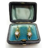 A pair of Victorian earrings each set with an old cut diamonds of approximately 0.3ct, in original